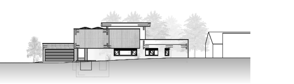 Le garage, le passage couvert et le volume en bois de l’étage