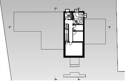Un volume enterré compact sous la maison, avec l’escalier, la buanderie et des locaux techniques